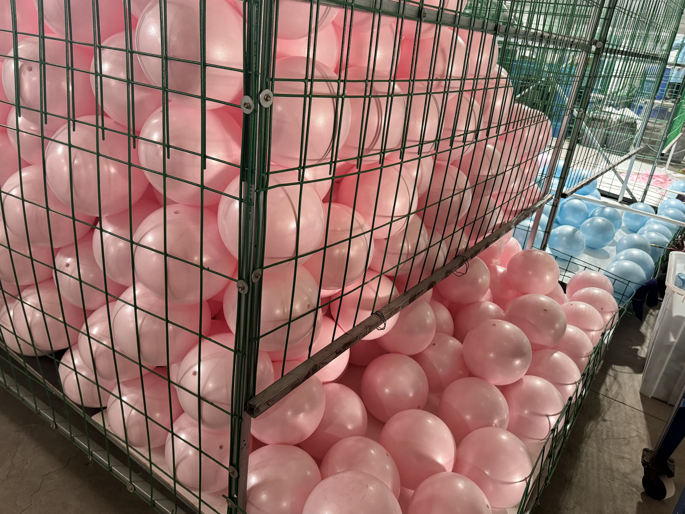 Pink and blue 25 cm mini Pilates ball batches inside WENKU's workshop